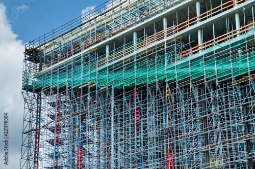 Construction of a high-rise building. Constructions. Abstract Scaffold Texture Background. Architecture.