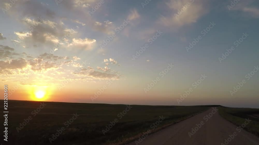 Sunrise Over Dirt Road Along field Sunrise Over Dirt Road Along field