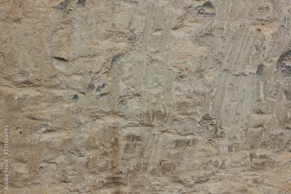 Obraz premium Texture of a stone wall. Vintage background. A wall of medieval buildings. Abstract pattern with a natural material