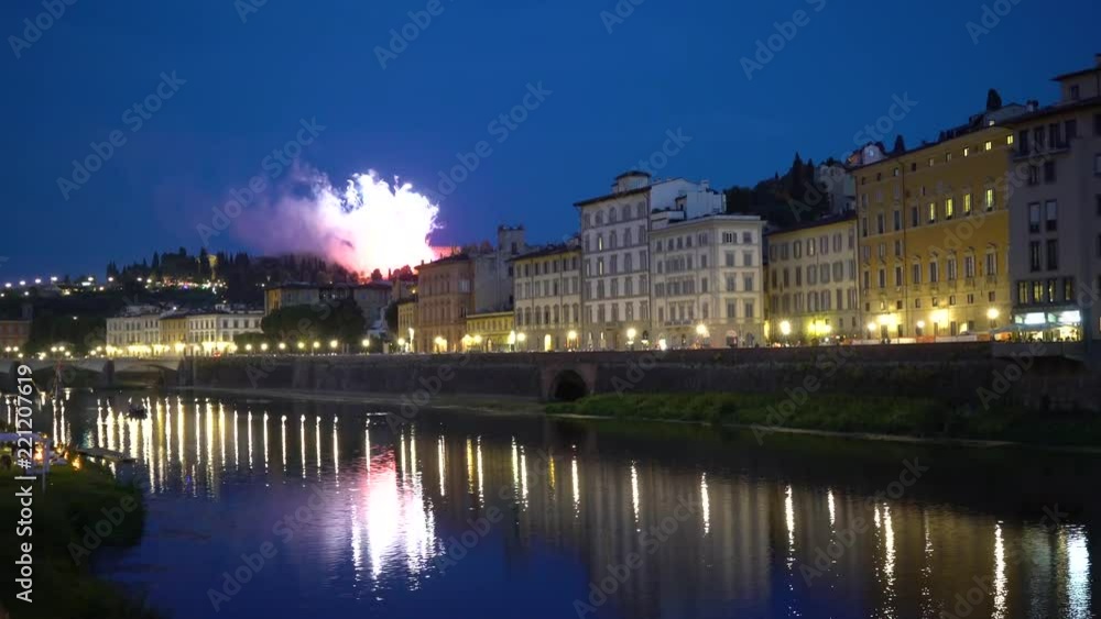Florence, Tuscany, Italy — 21 June 2018. Night view of the Arno river and fireworks Florence, Tuscany, Italy — 21 June 2018. Night view of the Arno river and fireworks