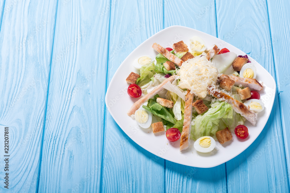 Salad ceasar with chicken , eggs and tomatoes