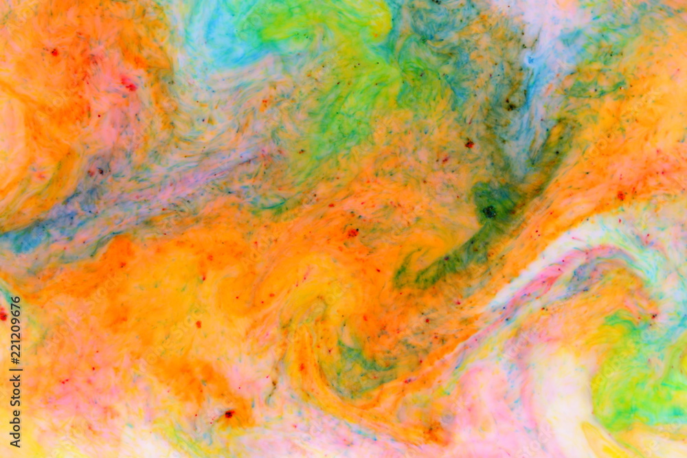 Fluid art. Abstract colorful background. Multicolored stains on liquid. Multicolored pattern with paints on liquid. Blurred background. Minimalism