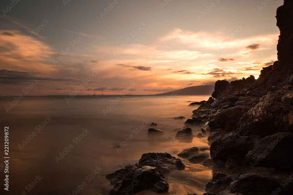 slow shutter of a rocky coastline at sunset