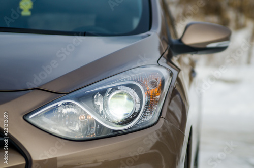 car in nature. Car headlight of a brown car © gerik_a