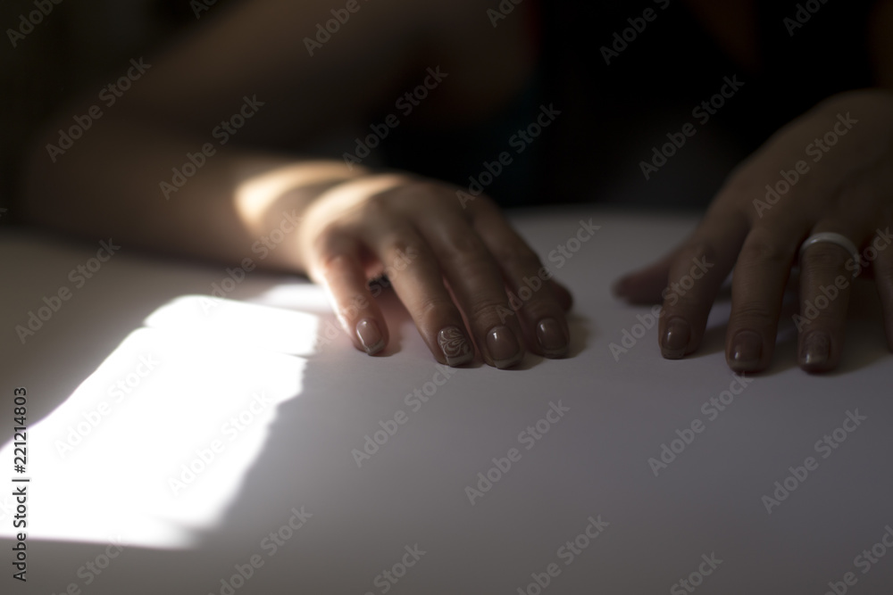 Obraz premium Hands of a girl after a manicure on a table