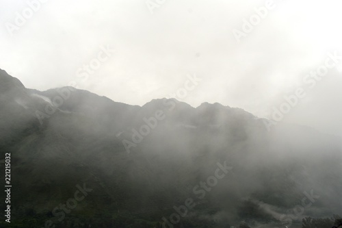 lush green mountains with clouds