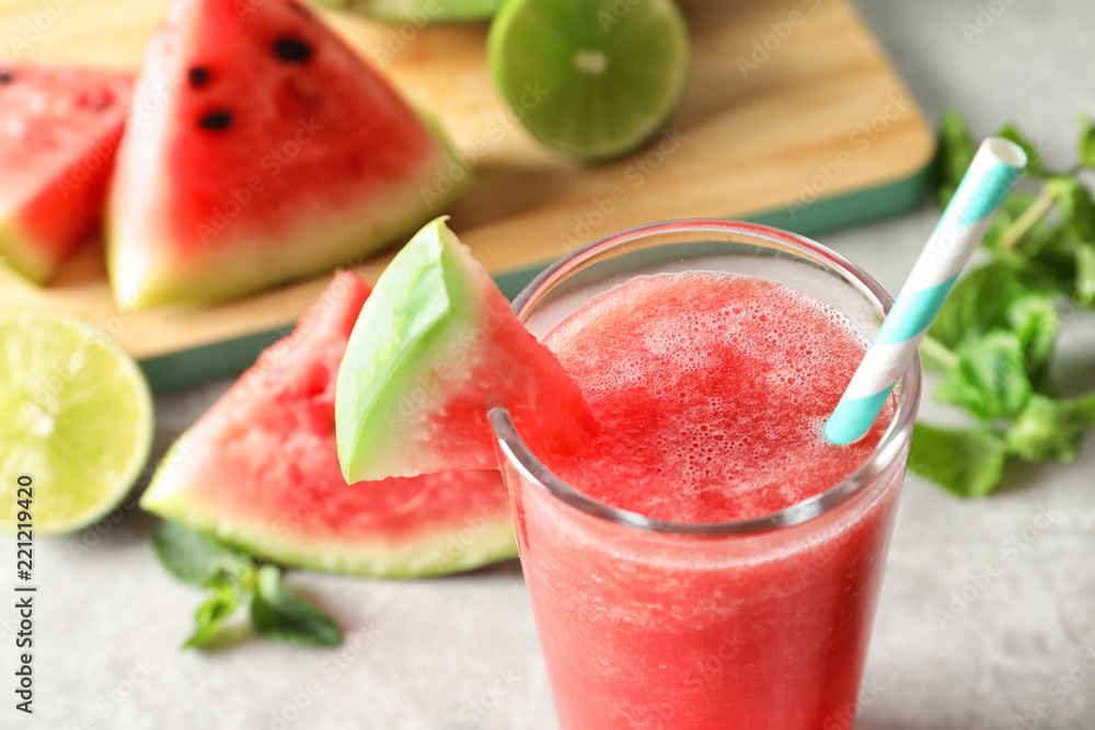 Tasty summer watermelon drink in glass on table, closeup Tasty summer watermelon drink in glass on table, closeup