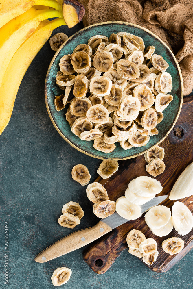 Dried banana chips and fresh bananas Dried banana chips and fresh bananas