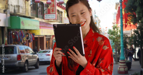 Close up of millennial woman video chatting with tablet in San Francisco