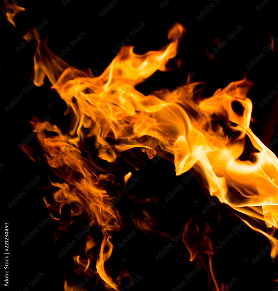 Fototapeta premium Flame of fire with sparks on a black background