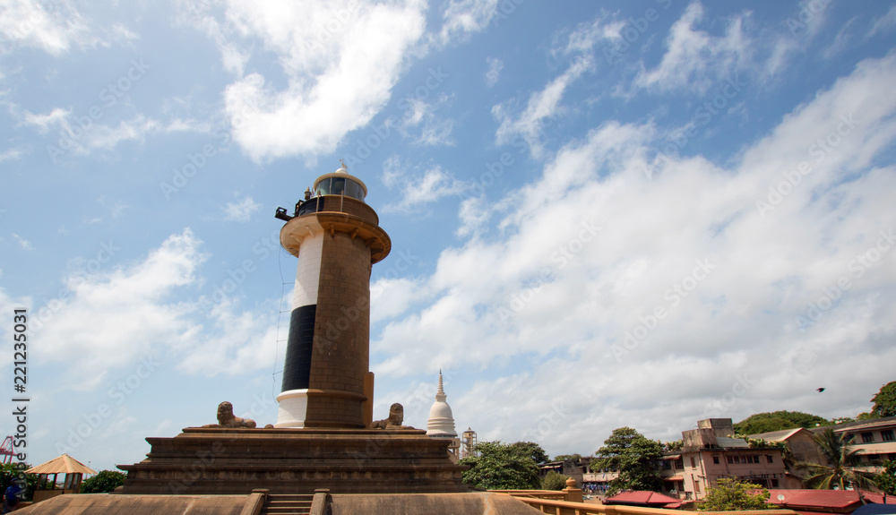 Old Lighthouse under cumulus clouds at the Galle Face in Colombo Sri Lanka Asia