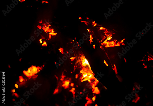 Flame of fire with sparks on a black background