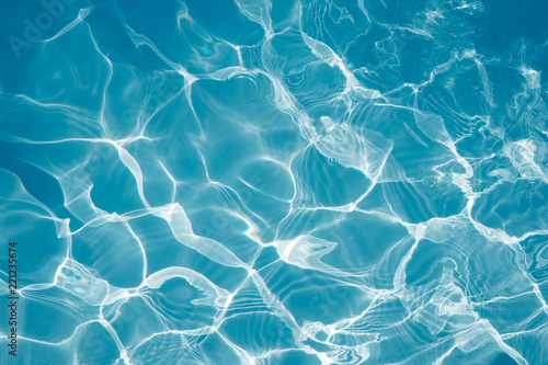 Surface of blue water swimming pool texture background