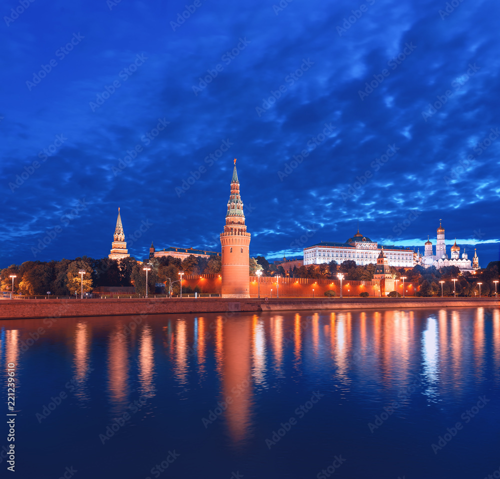 The Moscow Kremlin before dawn. Night illumination of the Kremlin and the reflection of the Vodovzvodnaya Tower in the Moscow River.