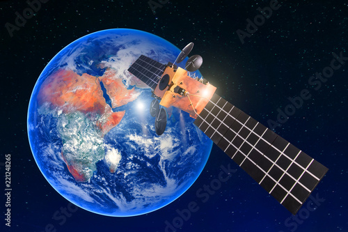 Satellite telecommunication connection, transmits radio communication on the geostationary orbit of the Earth. Against the background of the planet. Elements of this image furnished by NASA.