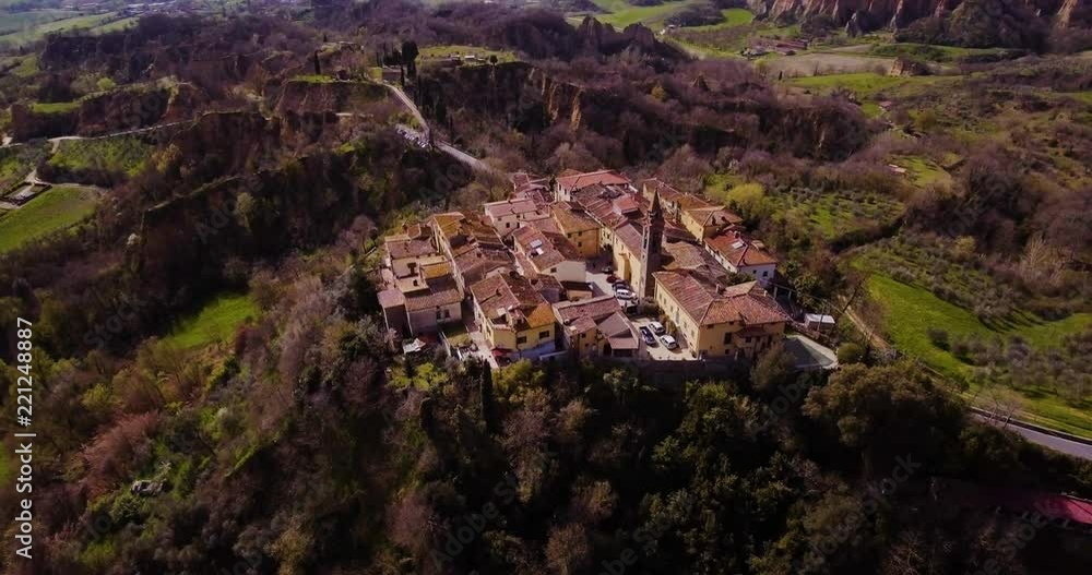 Aerial, Le Balze del Valdarno, giant ancient hills made of sand, clay, argil and gravel situated in Tuscany in Italy and a little town Piantravigne close to them Aerial, Le Balze del Valdarno, giant ancient hills made of sand, clay, argil and gravel situated in Tuscany in Italy and a little town Piantravigne close to them