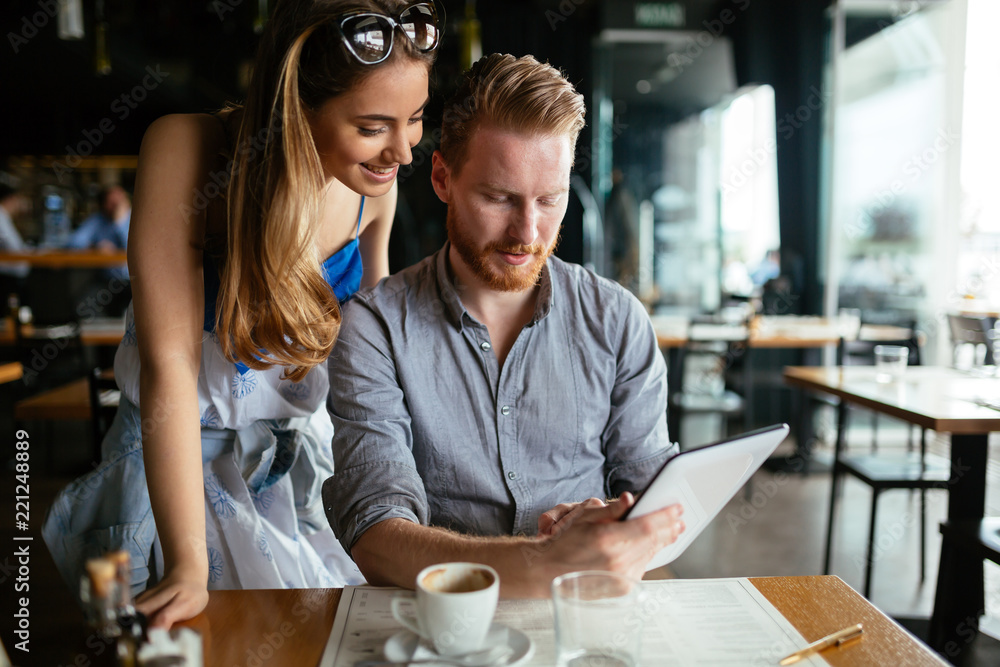 Woman and man flirting in cafe