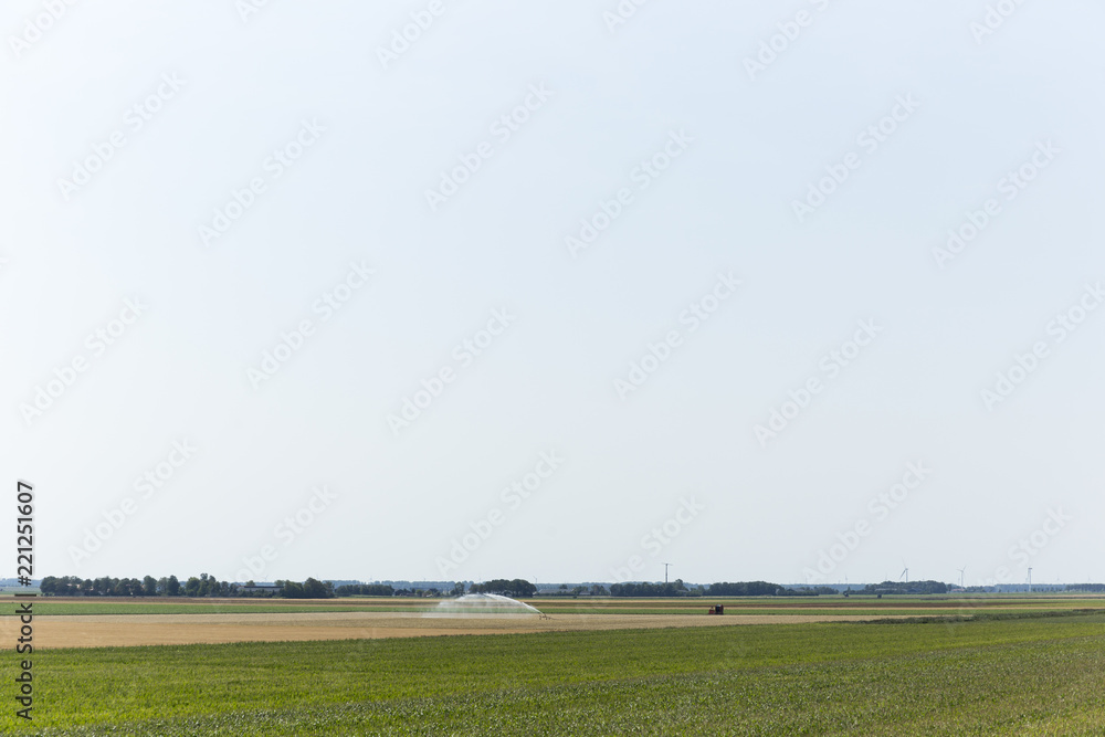 Agricultural Water Sprinkler In Open Field