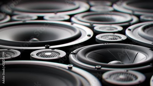 Vibrating speaker membranes stacked in endless loop. Lit by studio lights. 4K HD photo