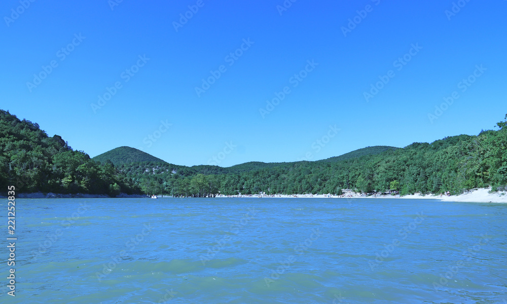 Sukko Lake. Krasnodar region. Russia. View of the unique cypresses and wooded slopes of the mountains.