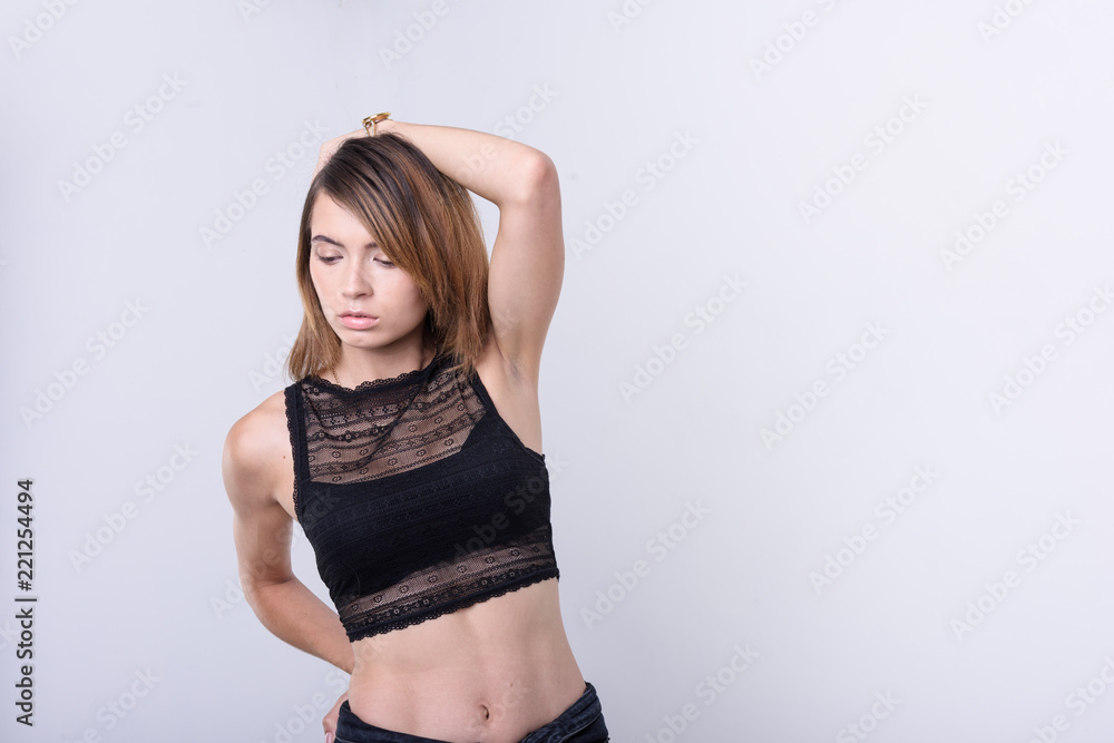 girl in black top on a white background girl in black top on a white background
