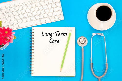 Stethoscope on notebook and pencil with Long Term Care words as medical concept photo
