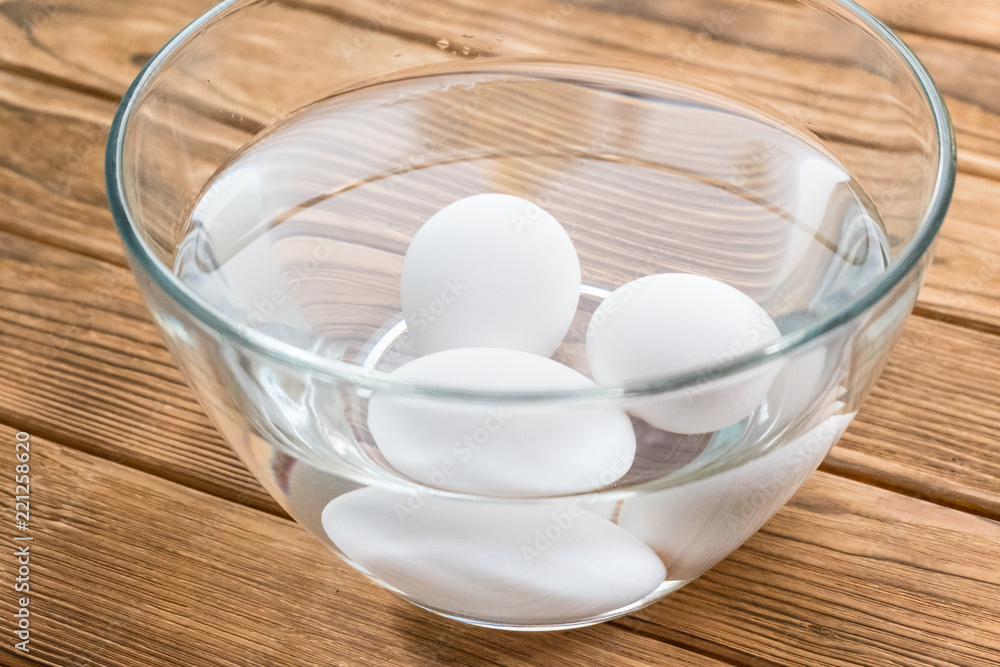 raw eggs in a bowl with water raw eggs in a bowl with water