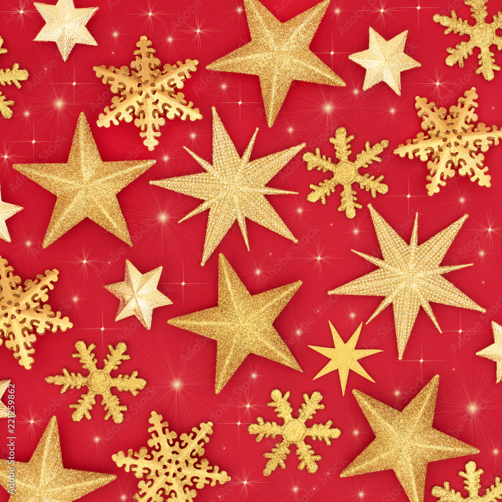 Sparkling gold star Christmas abstract background on red. Traditional festive card for the Christmas holiday season. Sparkling gold star Christmas abstract background on red. Traditional festive card for the Christmas holiday season.