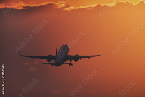 Aircraft taking off in the sunset