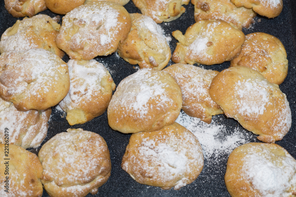 Homemade little apple cakes on baking tray Homemade little apple cakes on baking tray