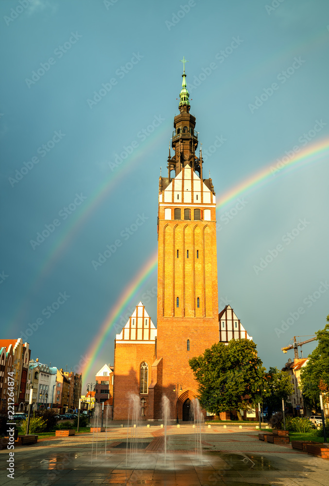 St. Nicholas Cathedral with a rainbow in Elblag, Poland
