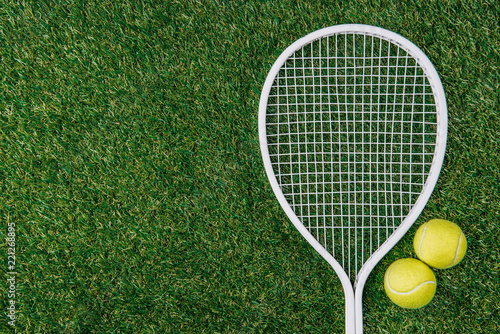 top view of tennis equipment of green grass © LIGHTFIELD STUDIOS
