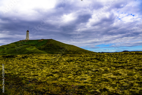 Beautiful Icelandic lighthouse against Atlantic Ocean. photo