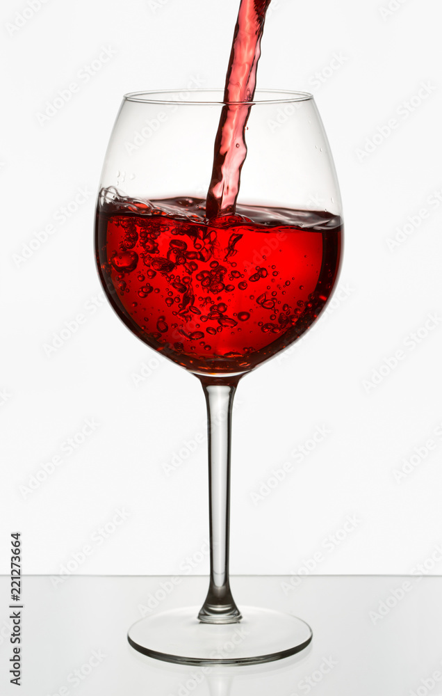 Beautiful splash of red wine in a glass Beautiful splash of red wine in a glass