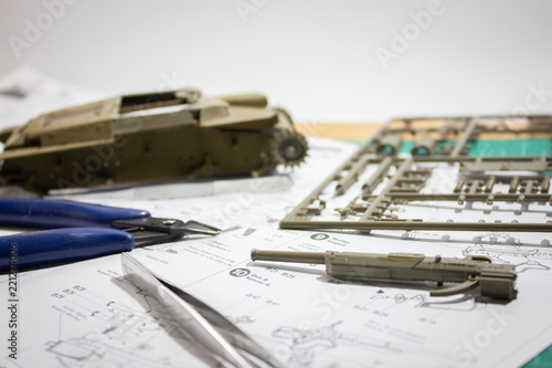 Scale model WW2 japan tank gun part building on Cutting Plate with scale modelling tools.