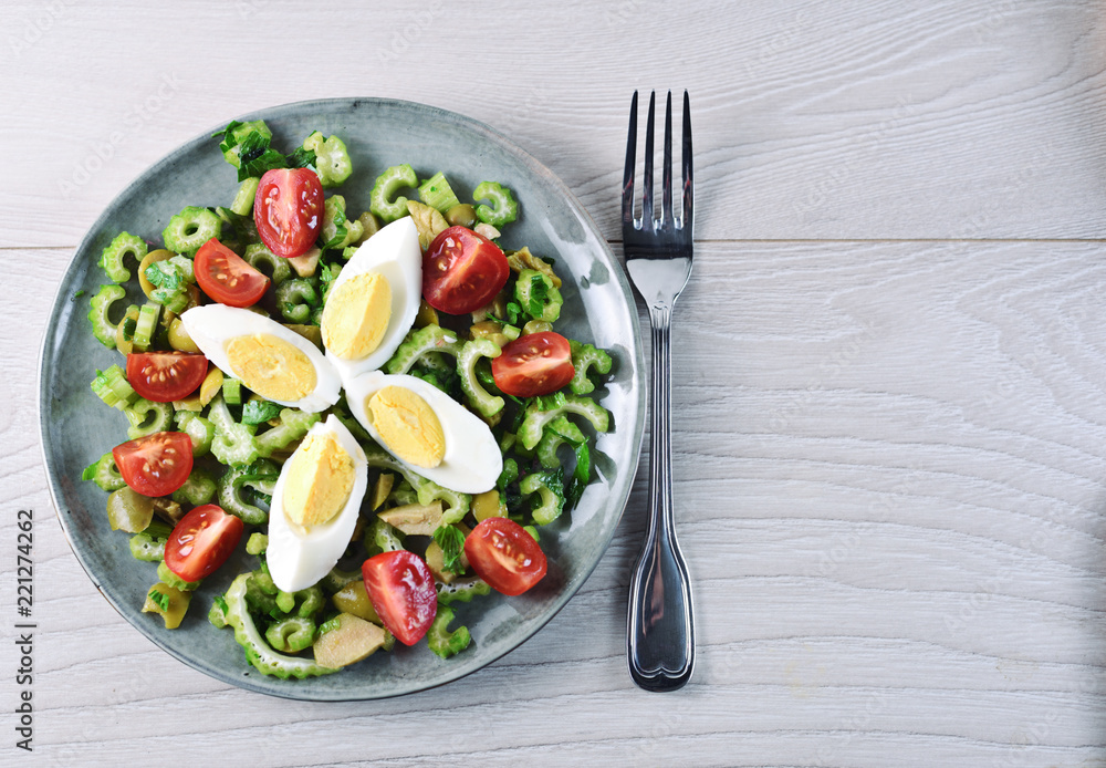 Celery salad with egg, olive and cherry tomato Celery salad with egg, olive and cherry tomato