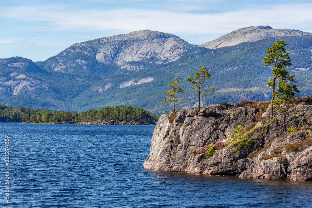 Wonderful landscape in Telemark region - blue lake in the mountain valley with stony shores, Southern Norway