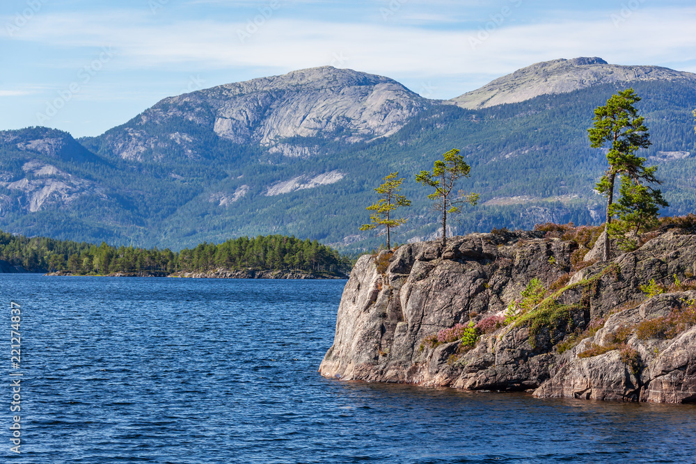 Wonderful landscape in Telemark region - blue lake in the mountain valley with stony shores, Southern Norway Wonderful landscape in Telemark region - blue lake in the mountain valley with stony shores, Southern Norway