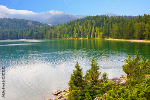 Fototapeta Naklejka Na Ścianę i Meble -  Lake, mountain and forest views from the shore