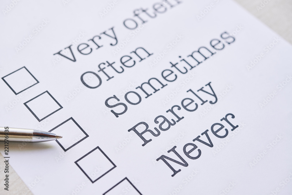 Document with frequency questionnaire and pen on table Document with frequency questionnaire and pen on table
