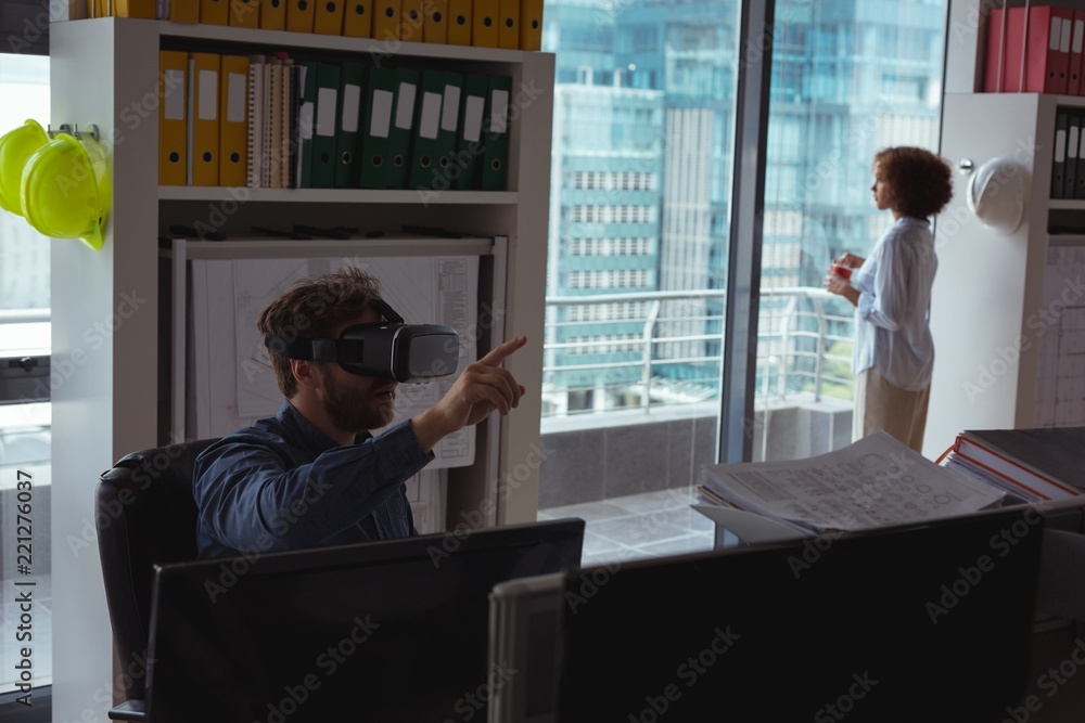 Male architect using virtual reality headset Male architect using virtual reality headset