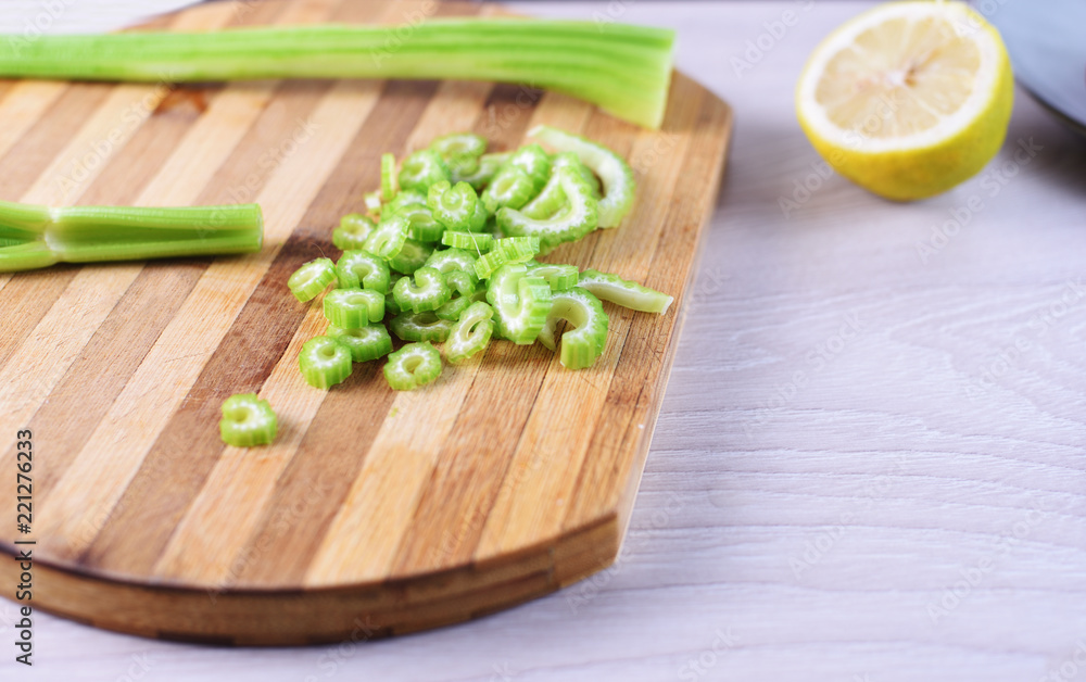 Sliced celery on cutting board Sliced celery on cutting board
