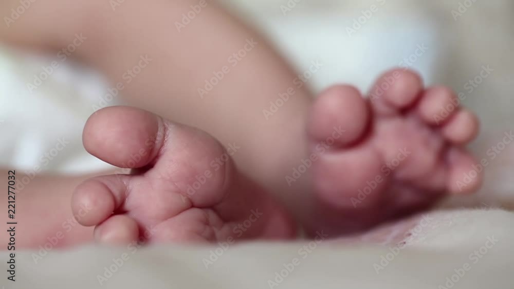 Newborn baby feet. Feet of neonatal 3 weeks old baby boy Newborn baby feet. Feet of neonatal 3 weeks old baby boy