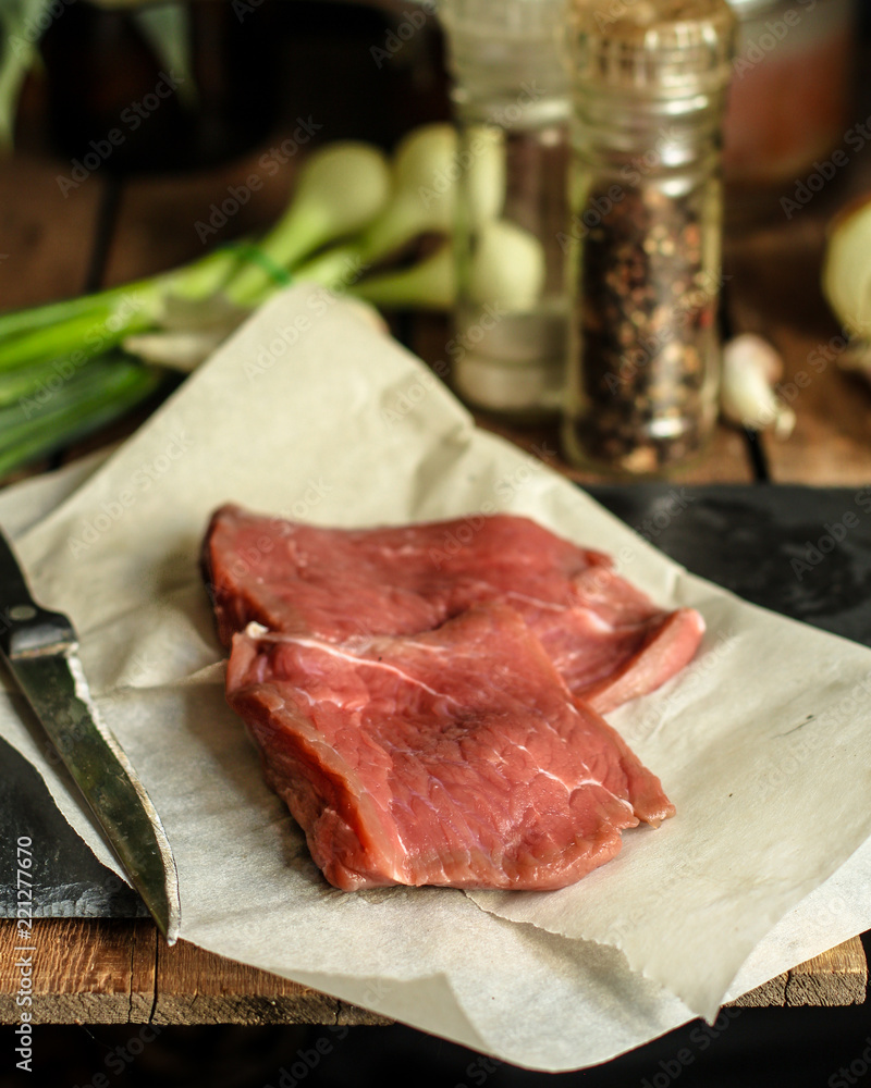 Raw meat, beef steak. a set of ingredients for cooking meat. . food background. top view