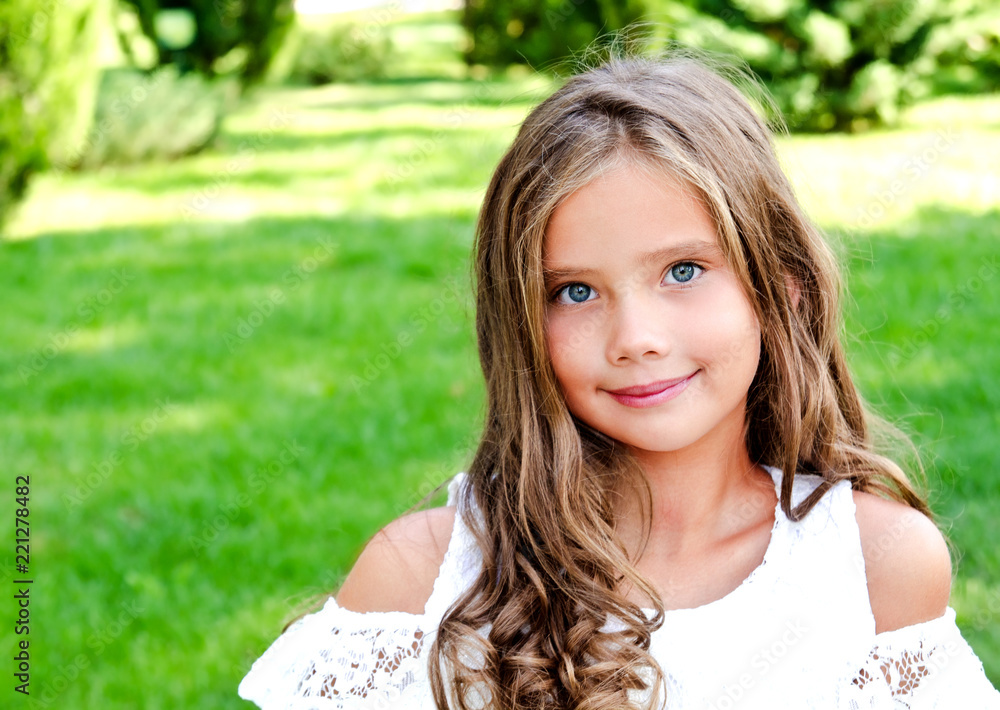 Portrait of adorable smiling little girl child outdoors Portrait of adorable smiling little girl child outdoors