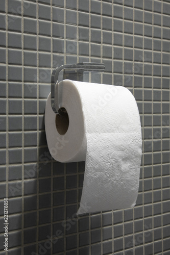 toilet paper on gray ceramic wall