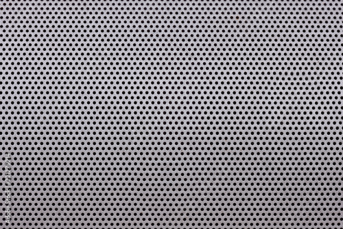 Close up of Metal sheet with small circular holes
