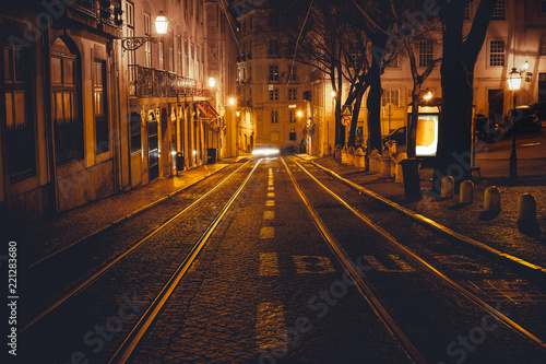 Urban night scene. Old European city illuminated street at night  Lisbon  Portugal