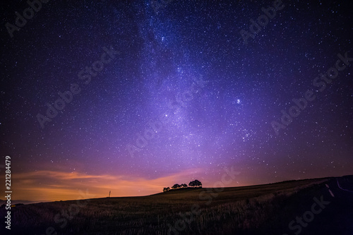 Milky Way and Starry Sky over Country Fields before Dawn