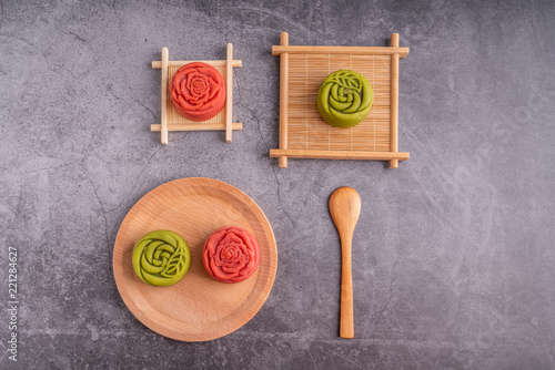 Red and green Mid-Autumn festival mooncakes are displayed